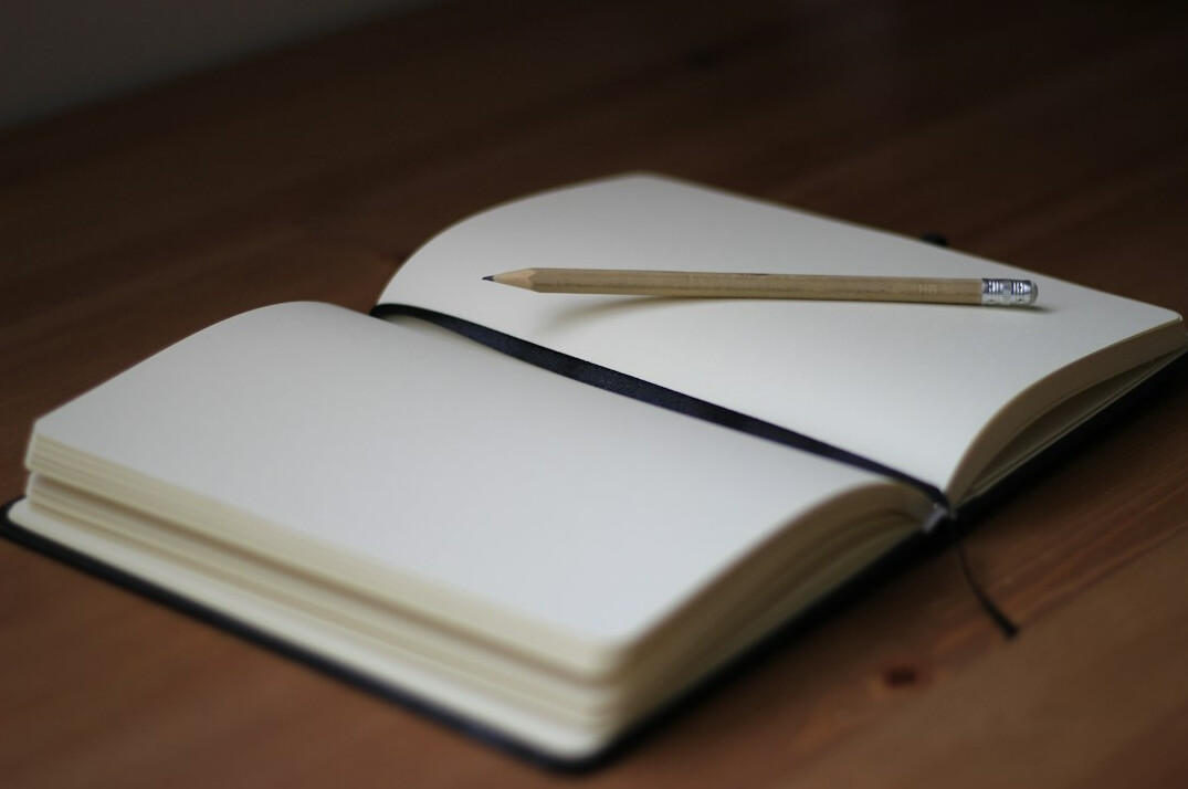 detective notebook and pen