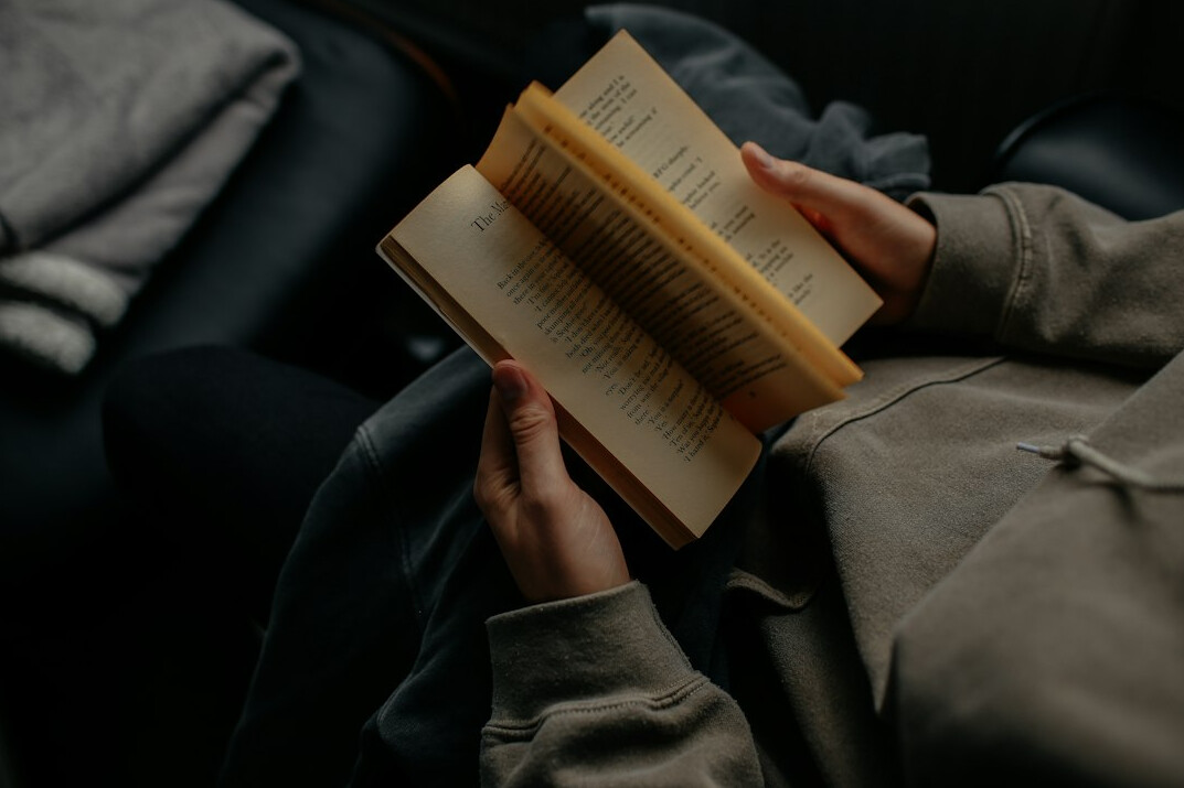 woman reading mystery book
